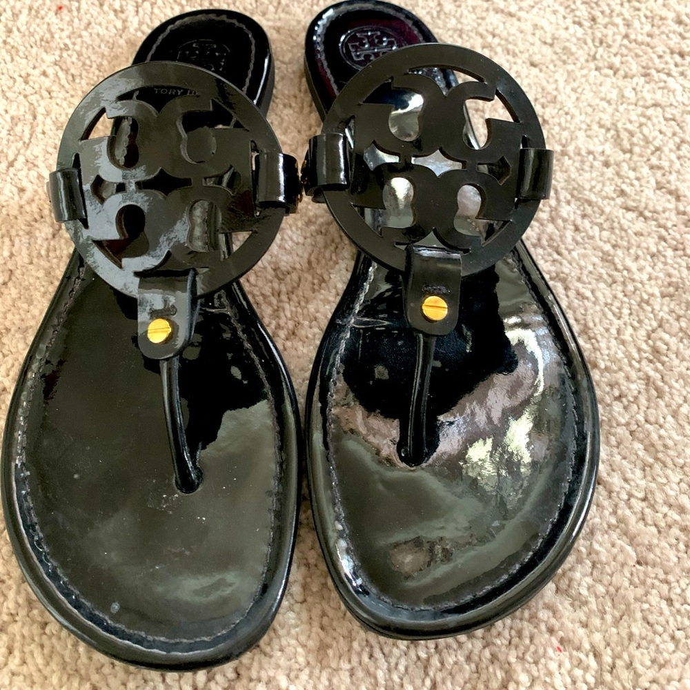 Tory Burch Miller black calf leather thong sandals.